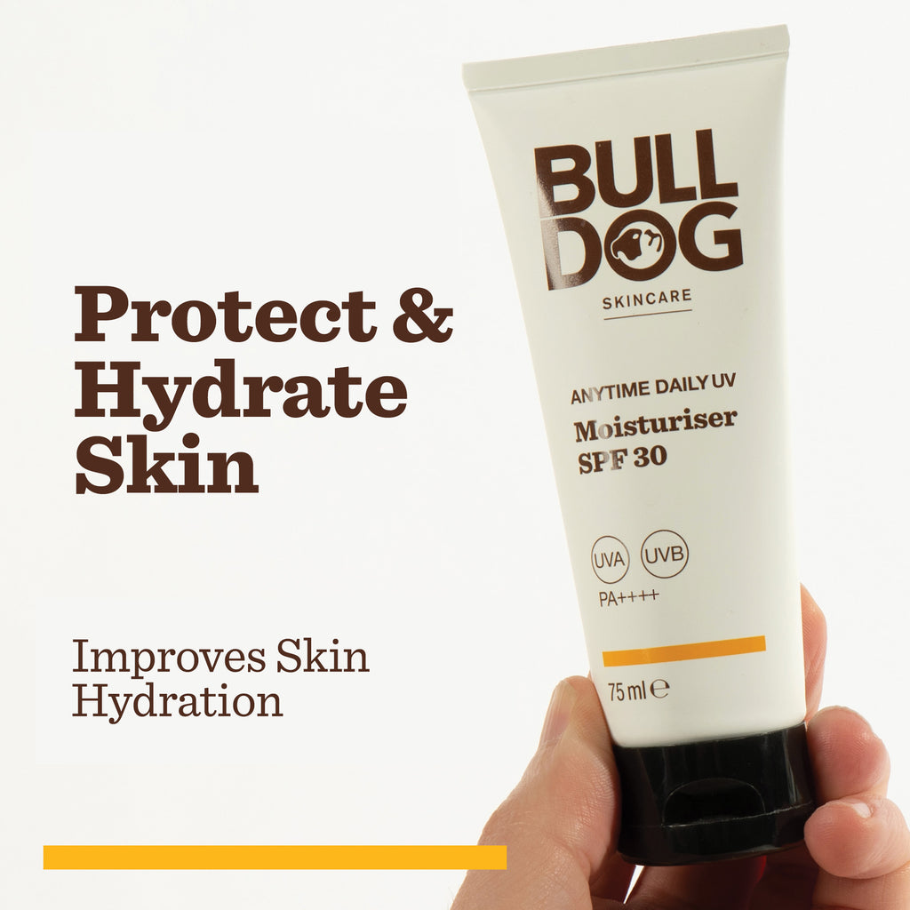 A hand holds a tube of Anytime Daily Moisturiser SPF 30. Text on the image: Protect & Hydrate Skin and Improves Skin Hydration. This white tube with brown text and orange accents offers UVA/UVB protection for daily use.