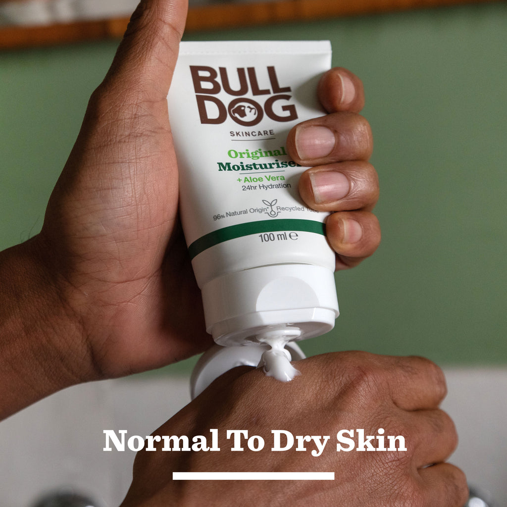 A person squeezes Moisturiser & Shower Gel Duo onto their hand, with “Normal To Dry Skin” below. Labeled for 24-hour hydration and enriched with aloe vera, it’s an ideal gift for men seeking effective daily care.