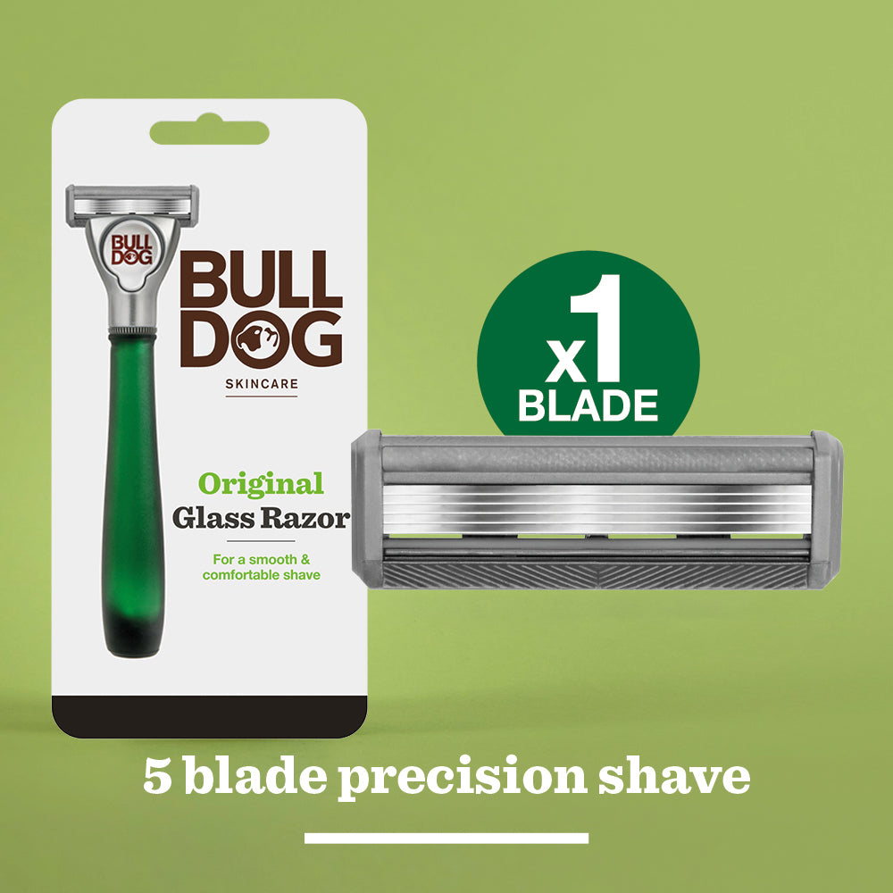 The Original Glass Razor in plastic-free packaging appears on a green background beside a close-up of its cartridge. Text reads: x1 Blade, 5-blade precision shave for a close, comfortable experience.