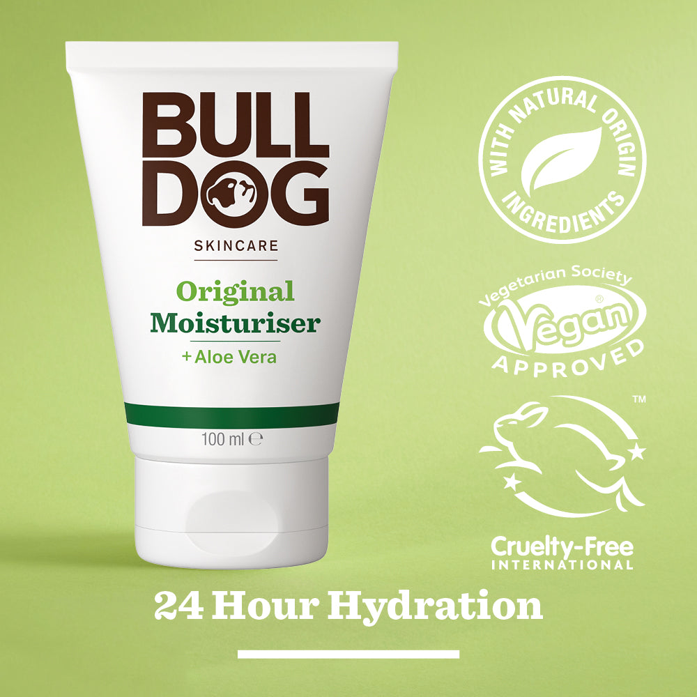 A tube of Original Moisturiser for men sits on a green background with labels highlighting natural origin ingredients, vegan approval, cruelty-free status, 24-hour hydration, and carbon neutral certification.