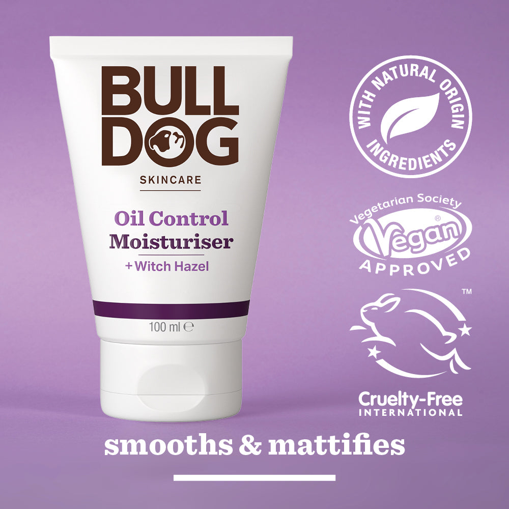 A tube of Oil Control Moisturiser for men stands on a purple surface, featuring labels for vegan, cruelty-free, natural origin ingredients, and suitability for oily skin.