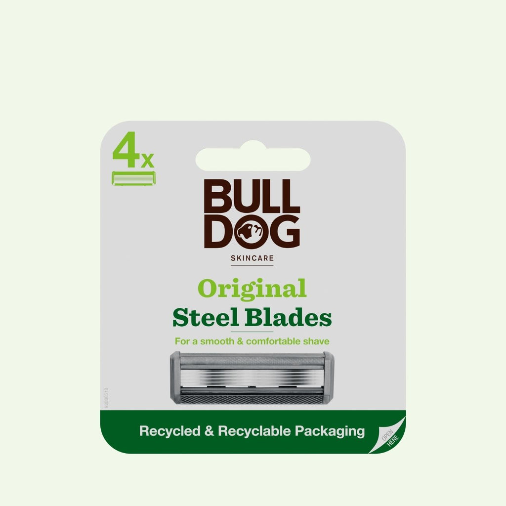 A pack of Original Steel Blades with four tempered steel blades and a lubricating strip, presented in recycled and recyclable packaging on a light background.