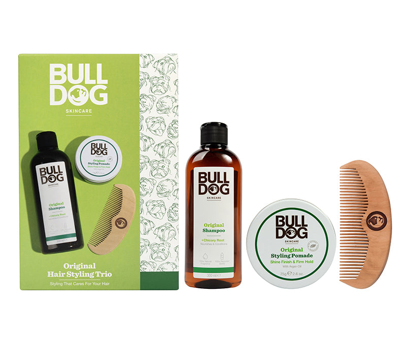 The Original Hair Styling Trio Giftset—containing a wooden comb, Original Shampoo, and Styling Pomade—makes a perfect gift for men. All items are shown beside green and yellow packaging.