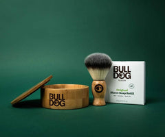 Original Shave Soap set on a green background with a wooden bowl and shaving brush—ideal for eco-friendly shaves, using natural origin ingredients.